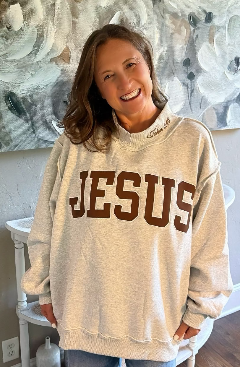 EMBROIDERED “JESUS” APPLIQUÉ MOCK-NECK SWEATSHIRT
